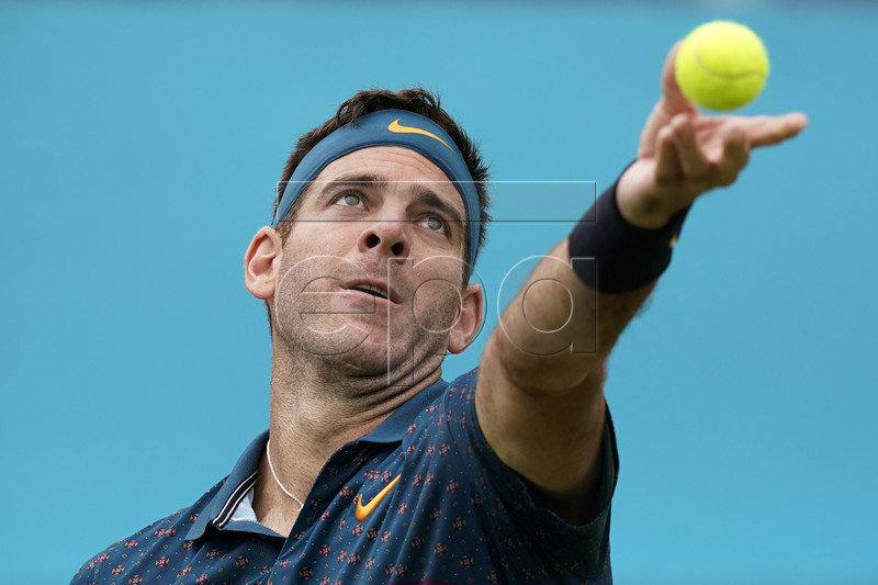 Argentina's Juan Martin del Potro serves to Canada's Denis Shapovalov during their round 32 match at the Fever Tree Championship at Queen's Club in London, Britain, 19 June 2019. The tournament runs from 17th June till 23 June 2019. EPA-EFE/WILL OLIVER